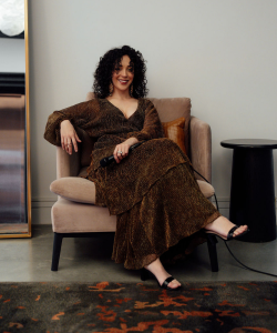 Taylor, singer, seated in an armchair