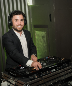 DJ Shortstar wearing headphones at the decks at a Sydney event