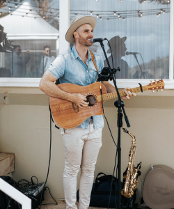 Dom Helson, Sydney singer-guitarist, performing with acoustic guitar